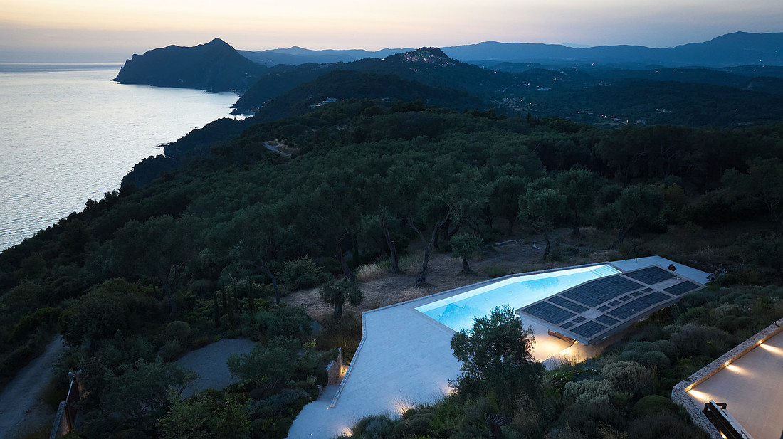 Aerial twilight view of villa and sea